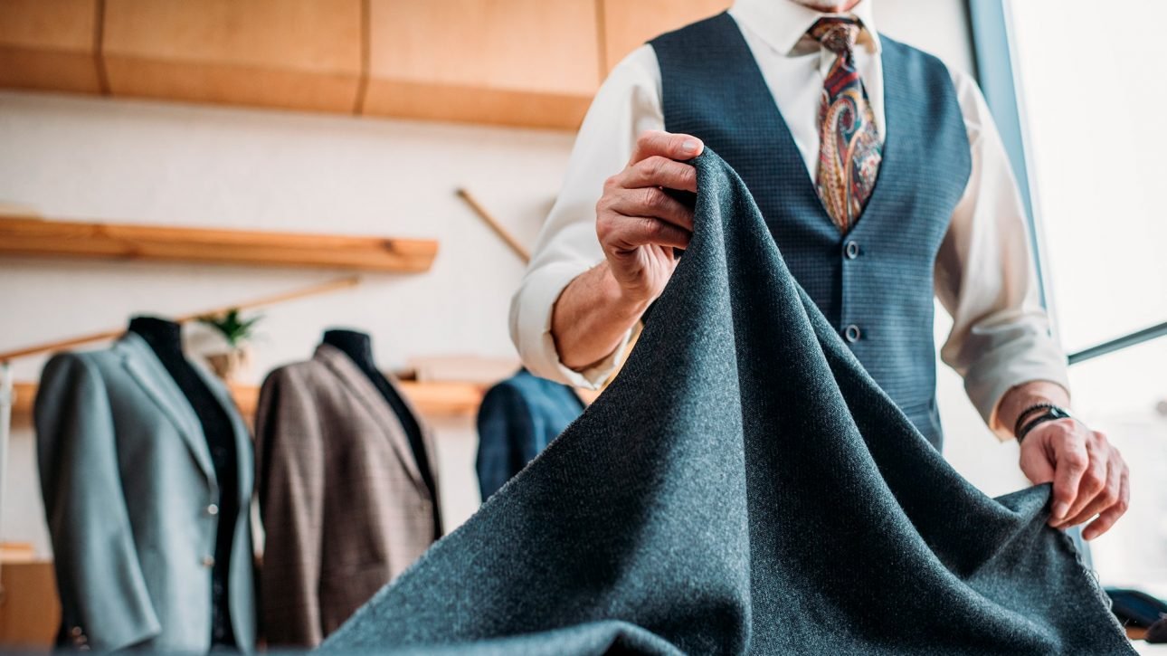 bespoke tailoring consultation client fitting luxury suit